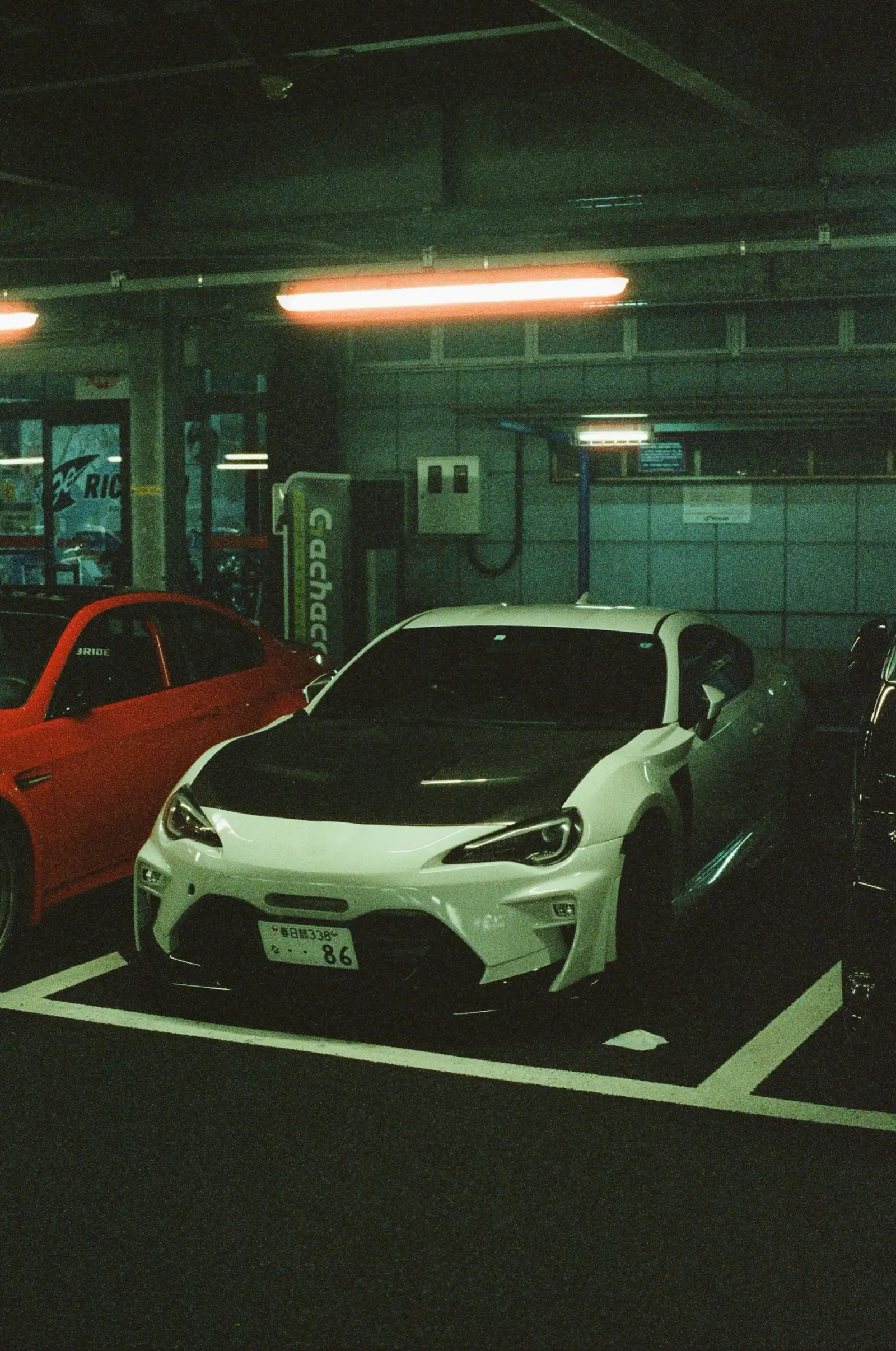 White Toyota 86 parked inside a garage
